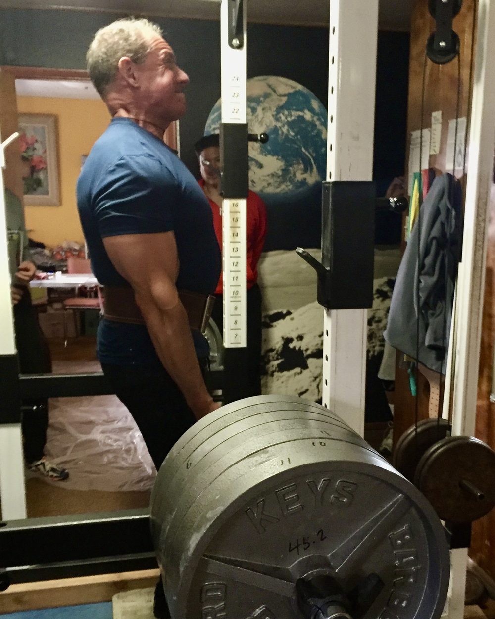 Ben setting up under a loaded barbell, training for the Senior Games