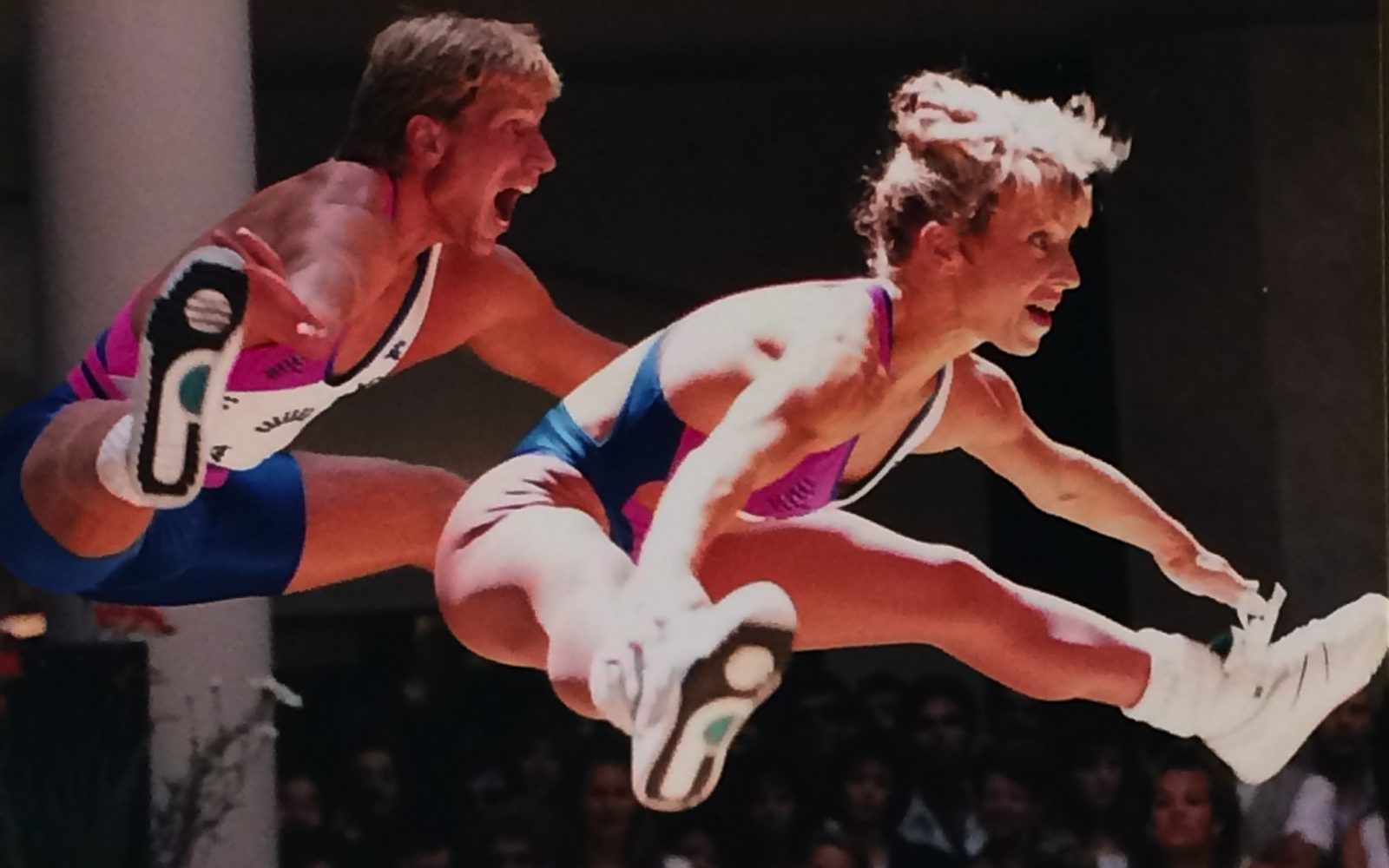 Loree and her partner leaping in matching competition outfits at the 1990 Reebok National Championship